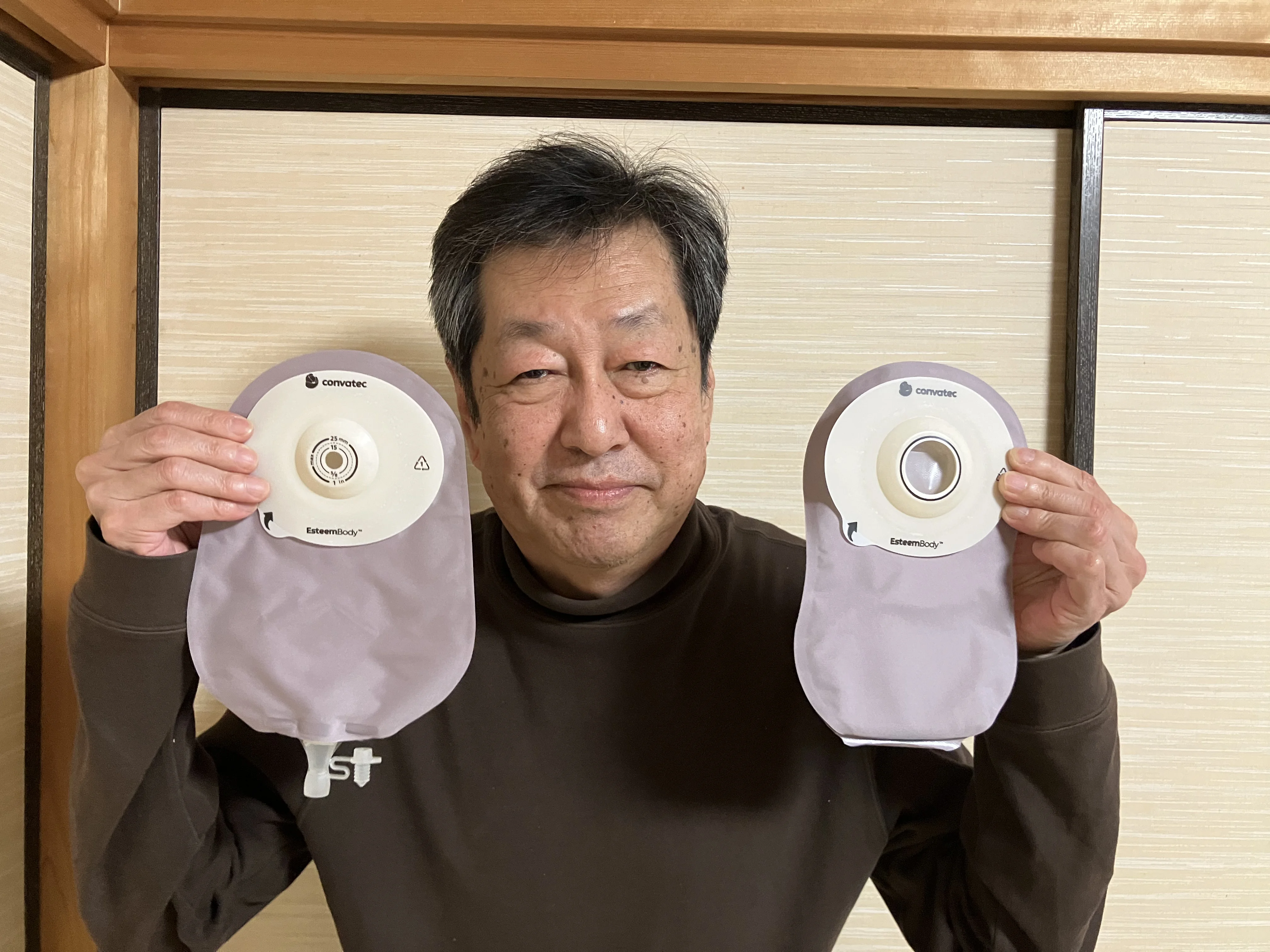 An image introducing Esteem Body™ as a new one-piece soft convex ostomy system with Leak Defense™, with a woman holding dumbbells while jogging in the image background.